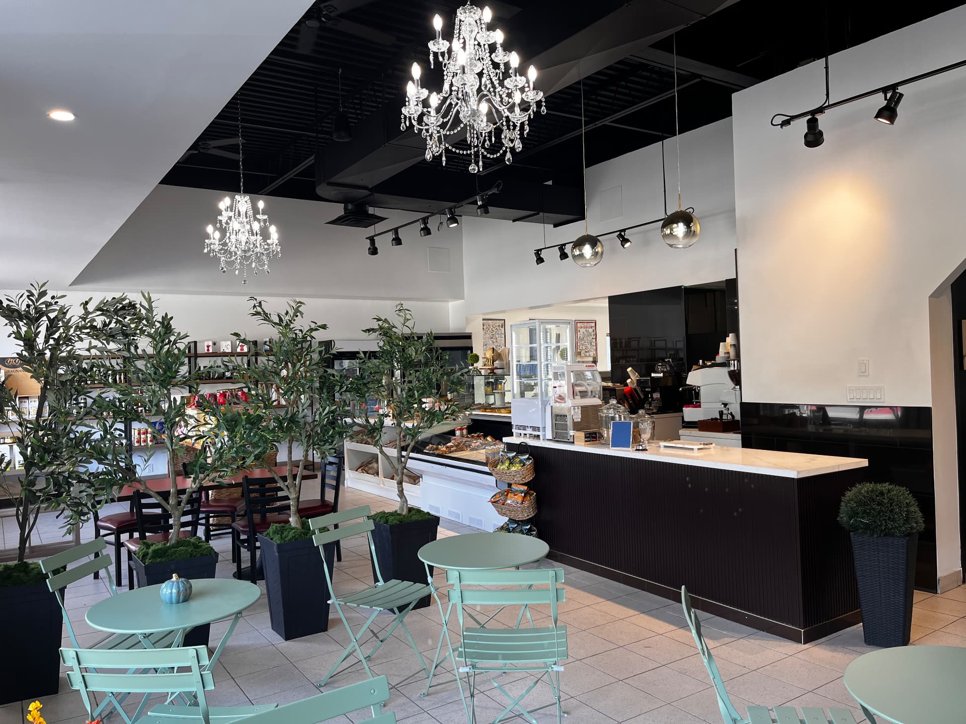 Our café with crystal chandeliers and olive trees